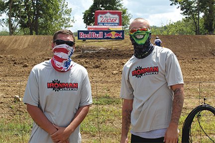 North Montgomery graduates and Crawfordsville residents Seth Beasley, left and Brandon Conkright work security at Ironman Raceway on Saturday.